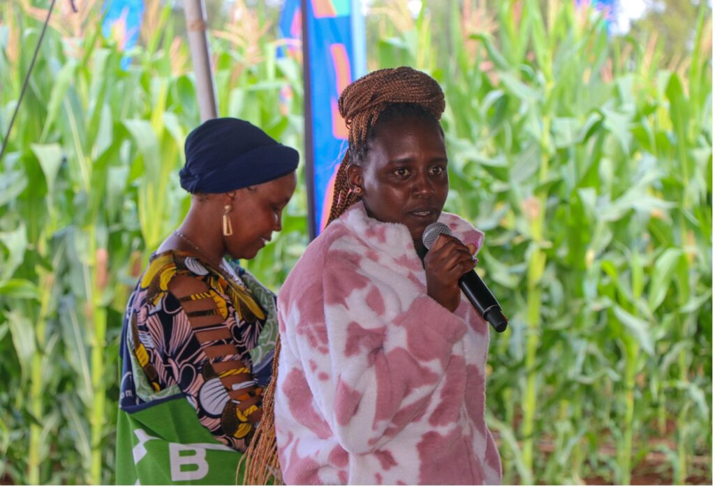 Figure 2: Susan Wairimu, 24-year-old FSC, addressing attendees of the Bayer Farmer Field Day at Kiminja, Kirinyaga on 27th August 2024| Photo by CGA Communications